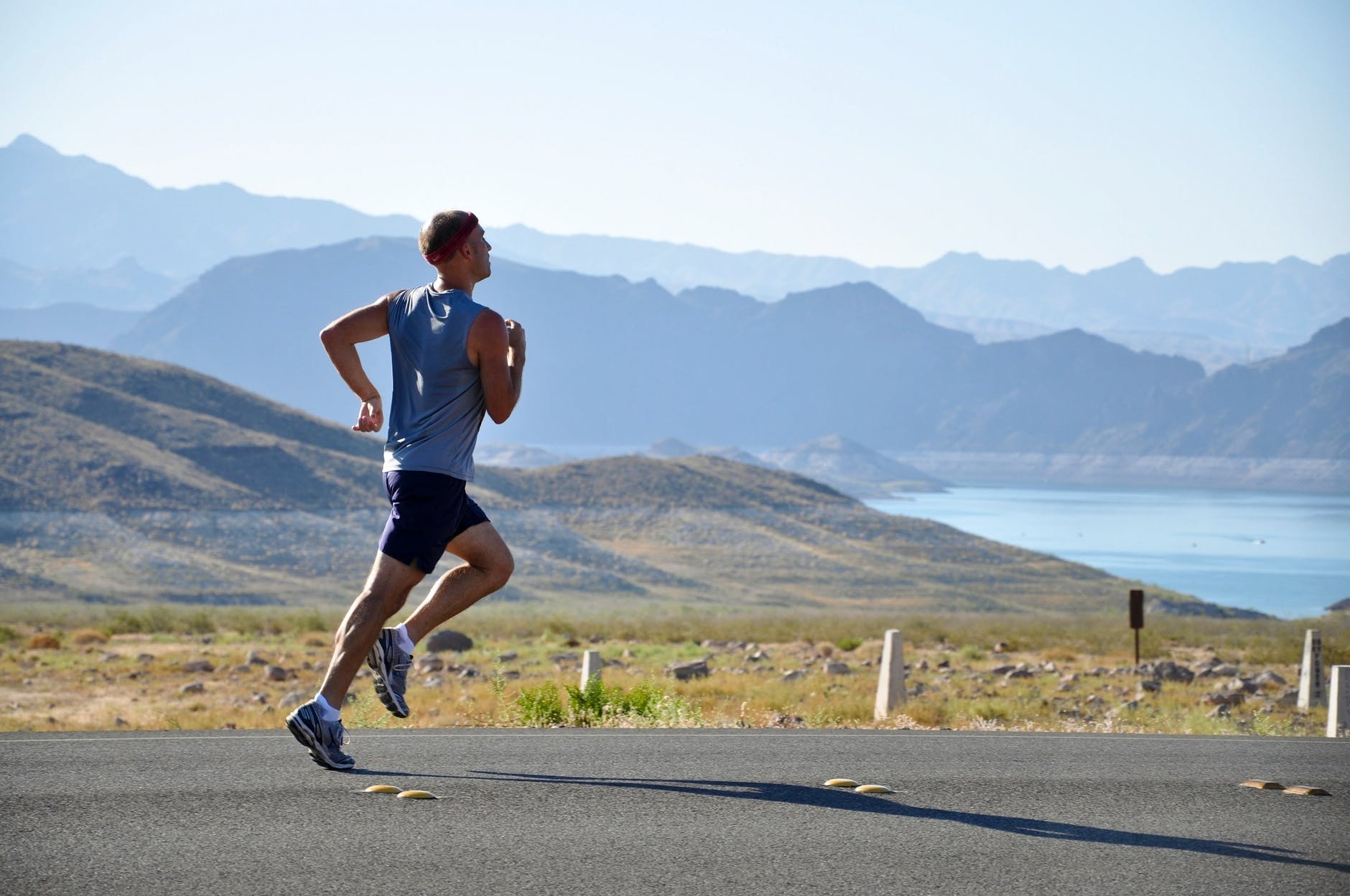 man running on side of road health man running